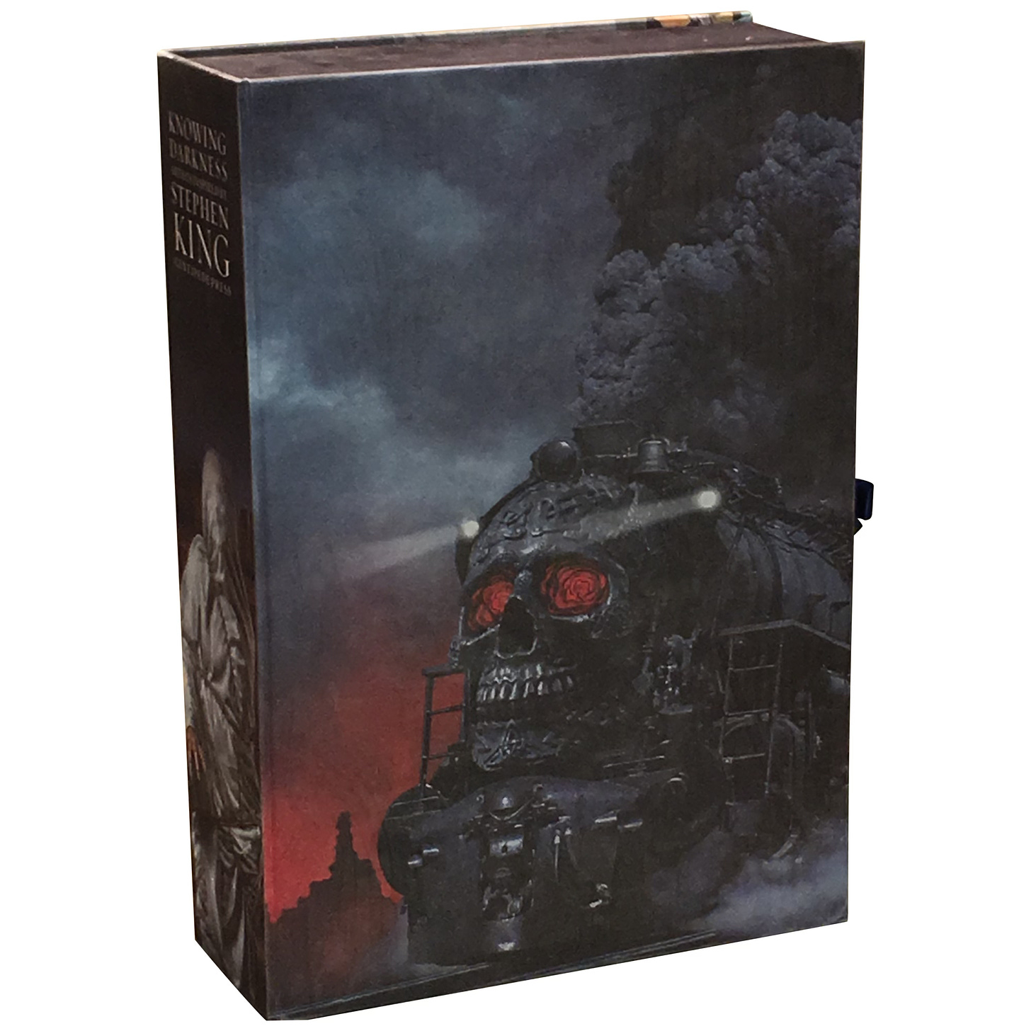 Angled view of the traycase for KNOWING DARKNESS. On the spine is Michael's painting DEAD END, which features a figure cover in a sheet and bound by barbed wire.