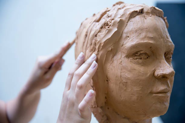 Artist Working On Clay Sculpture In Art Studio Stock Photo - Download Image  Now - Sculpture, Sculptor, Clay - iStock