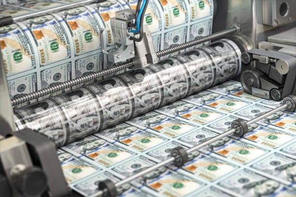 https://media.istockphoto.com/id/1455029754/photo/printing-money-dollar-bills-on-a-print-machine-in-typography-finance-tax-stock-market-and.jpg?s=612x612&w=0&k=20&c=kMT5jNbES1OjtHSYHg0yOJ-7iJ3N0gsAC4F_q1bzOOY=