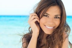 tanned woman smiling 