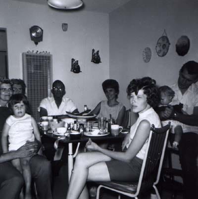 A black and white photo of my grandparents, cousins, aunt, uncle, and my mom