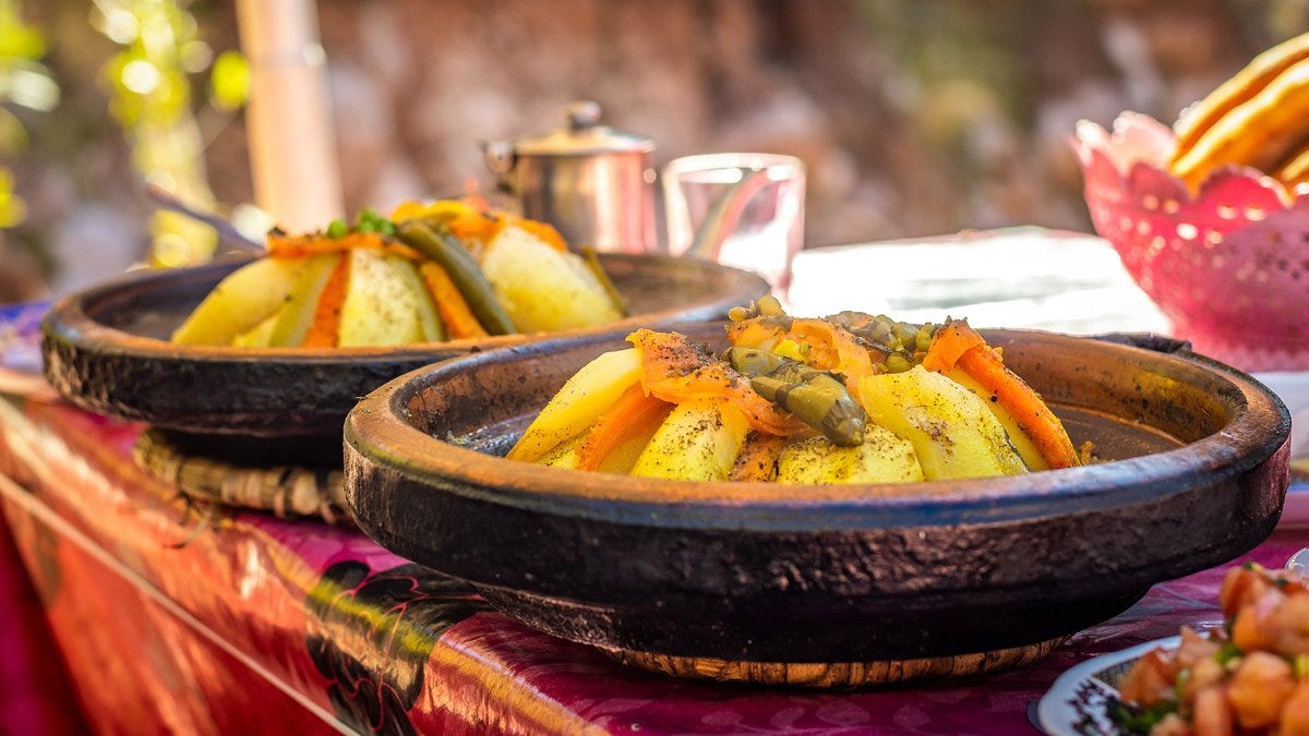 Two traditional Moroccan chicken tagine with chickpeas and vegetables