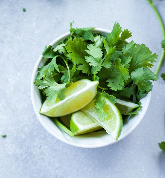 sliced lime in white ceramic bowl