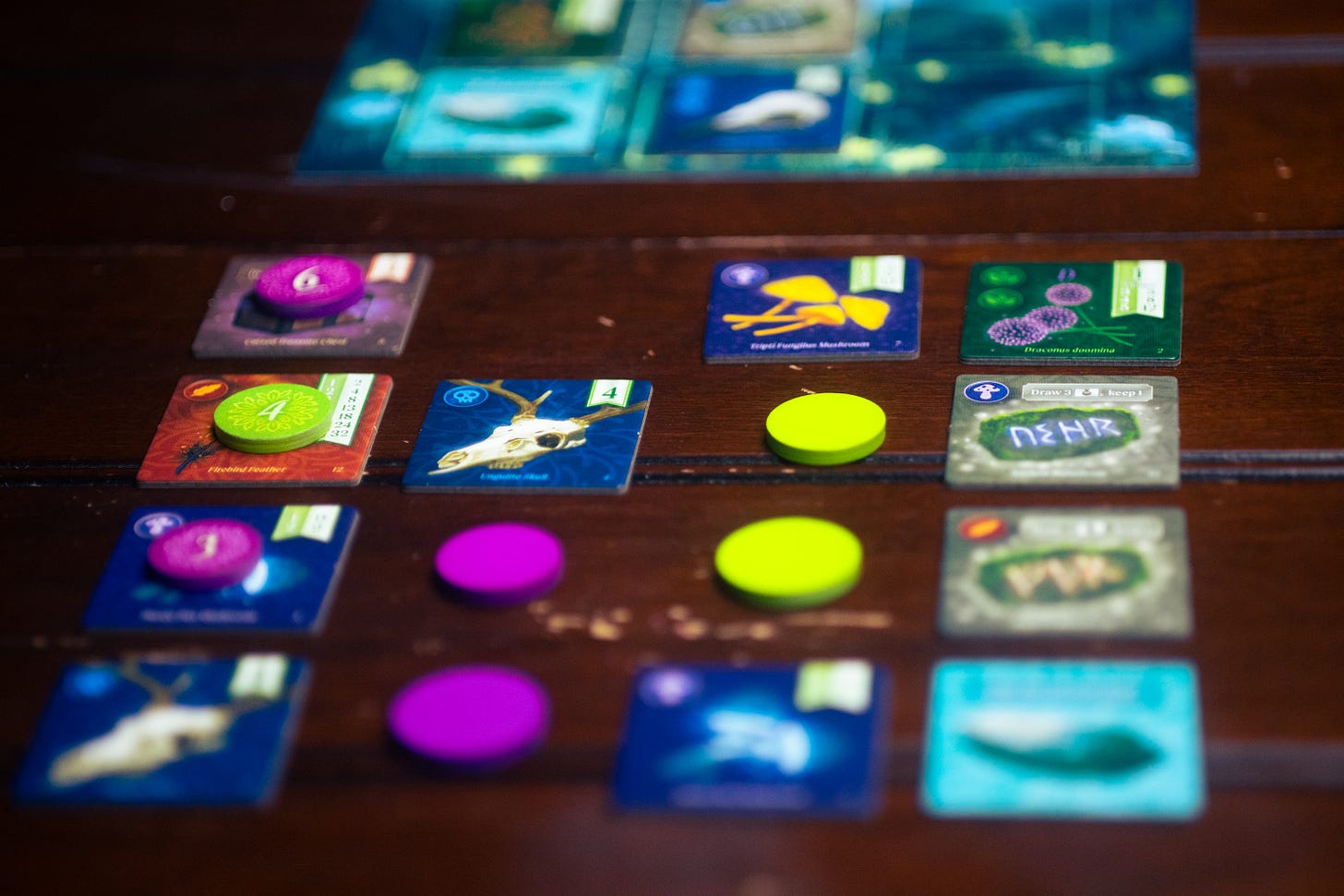 Tiles from the board game Nocturne during play on a table.