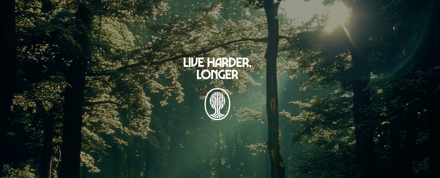 The words Live Harder, Longer, in white text on a generic forest background.