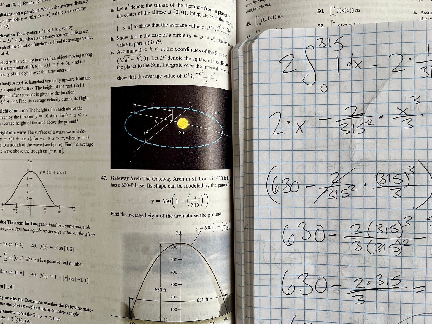 Calculus book and notebook with equations