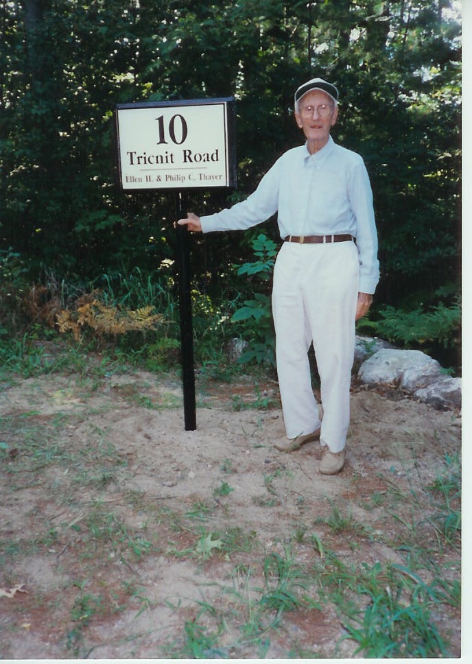 Man near tricnit sign