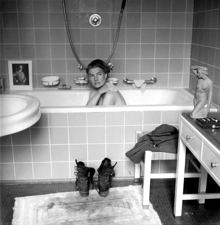 A photograph of Lee Miller in Hitler’s Bathtub, on the day he committed suicide