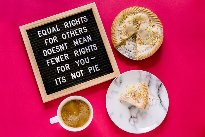 A pink background with a pie and a message that says: equal rights for others doesn’t mean fewer rights for you — it’s not pie. A pink background with a pie and a message that says: equal rights for others doesn’t mean fewer rights for you — it’s not pie.