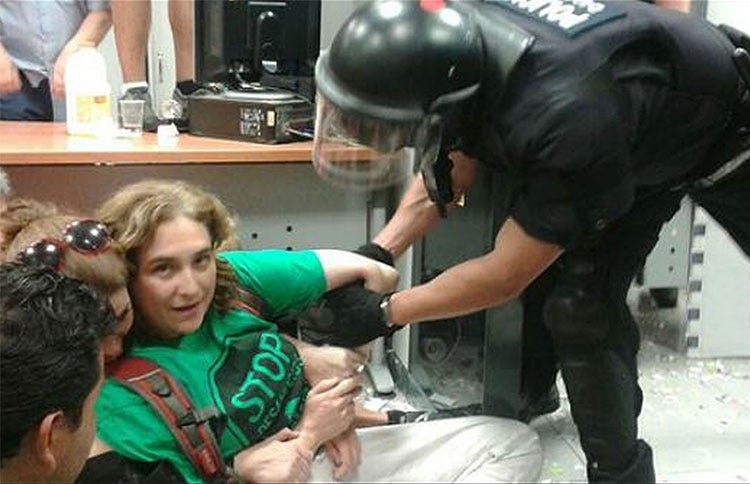 Mayor Colau of Barcelona being arrested at a housing rights action the day before winning her first election to office.