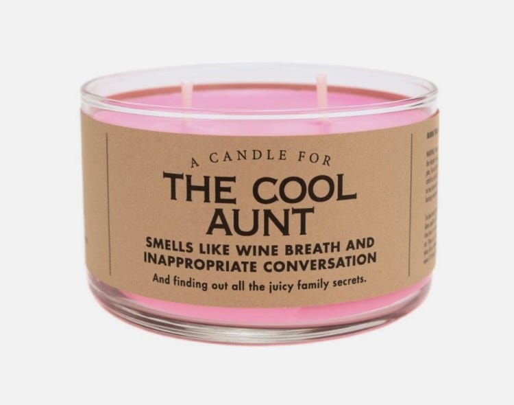 Image of a pink canlde with the label: The Cool Aunt. Smells like wine breath and inappropriate conversations. 