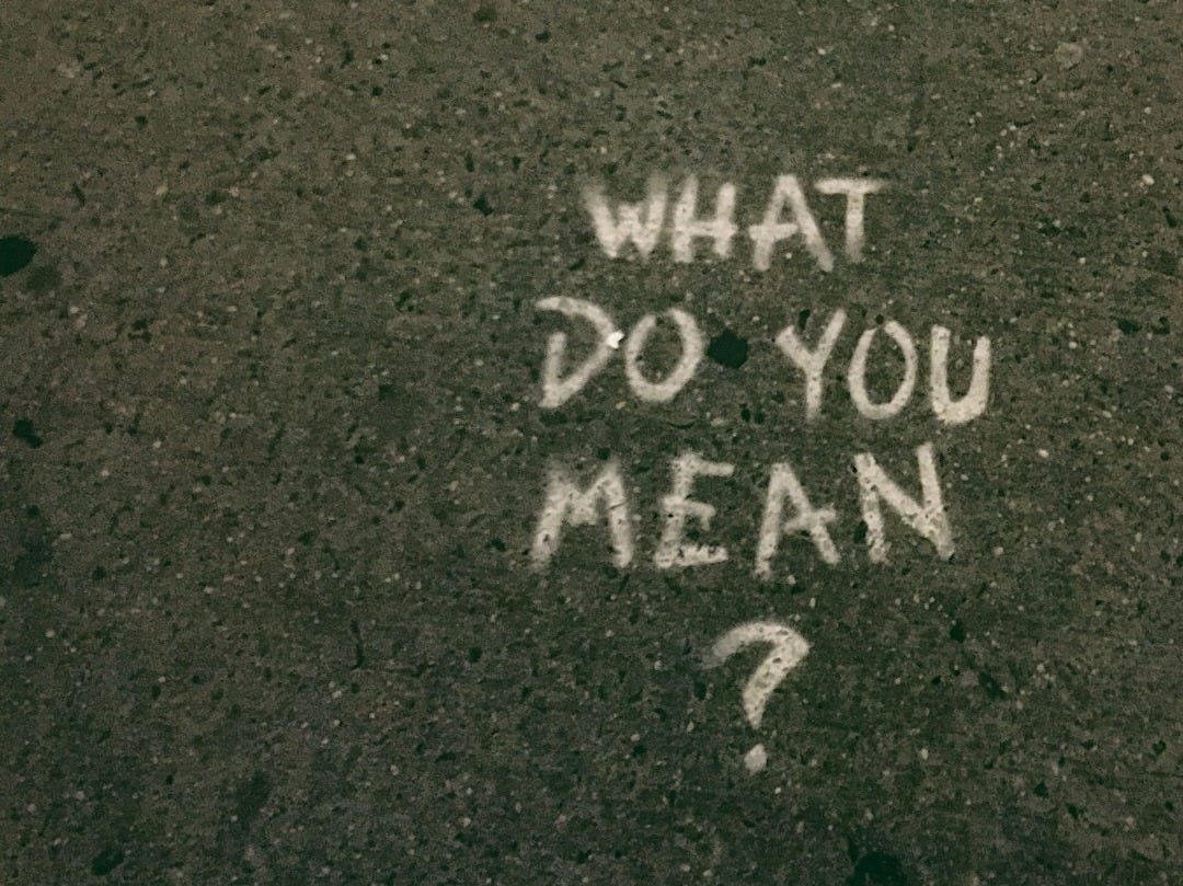 what do you mean? text on gray surface