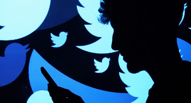 The Twitter logo is projected. | Getty