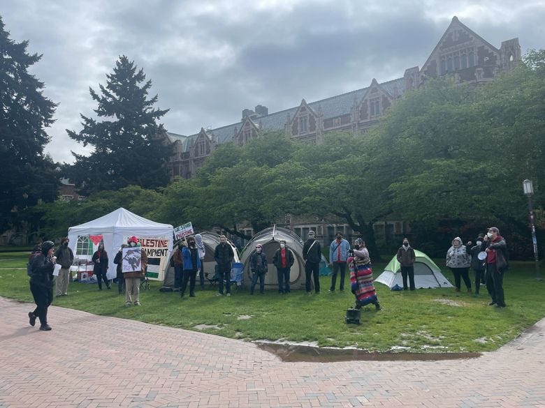 Protesters have erected a few tents along the Quad at the University of Washington campus on Monday, April 29, 2024, calling for the school to cut ties with Boeing and end its study abroad programs to Israel, among other demands. (Ivy Ceballo / The Seattle Times)