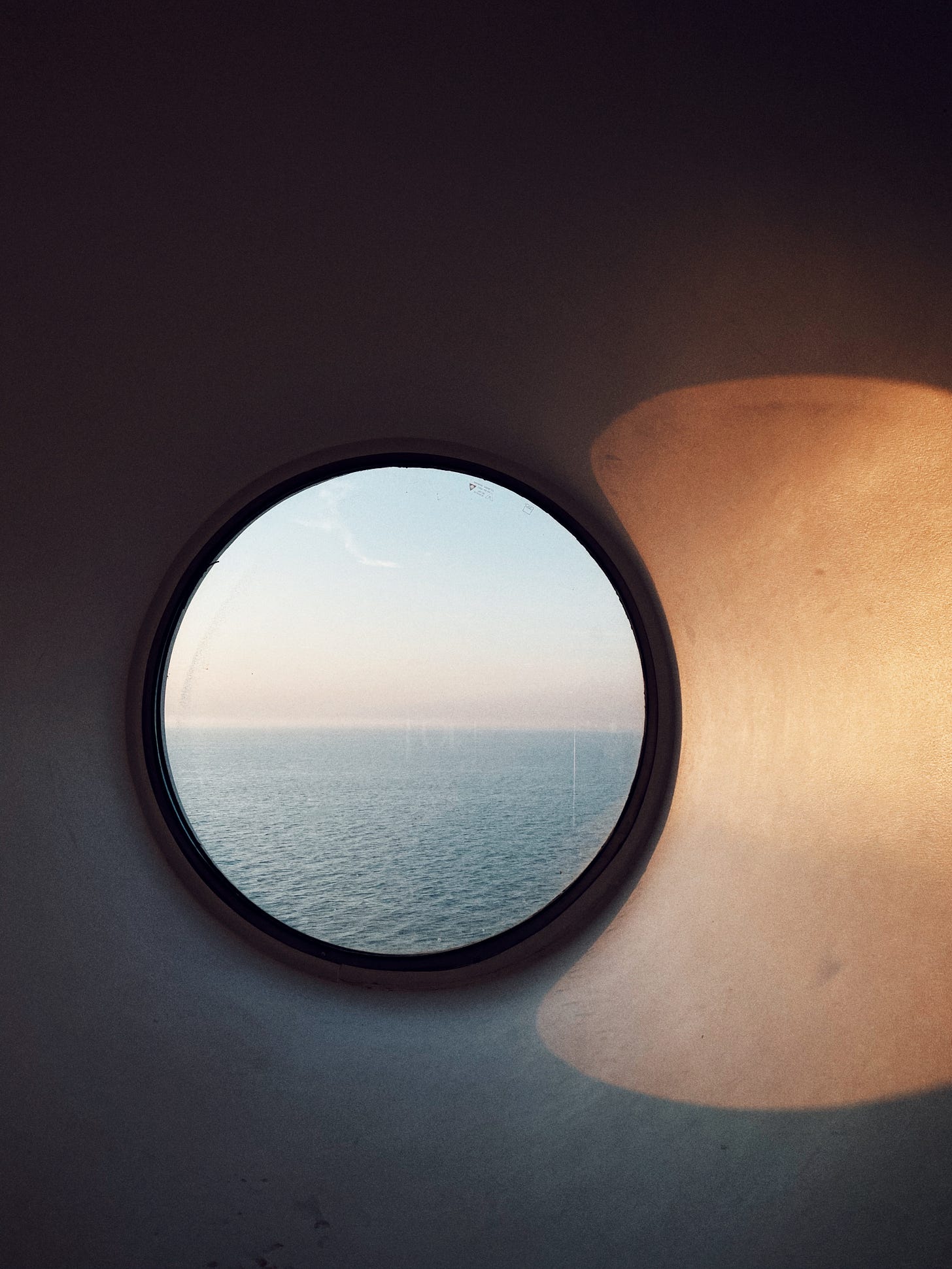 cruise ship window sunset