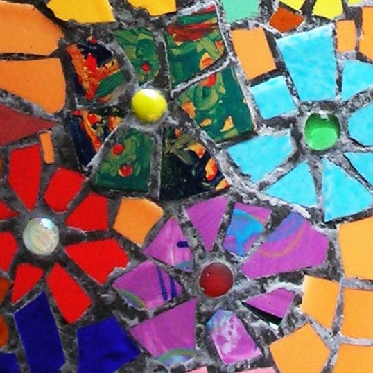 A colourful image by Helen Sword depicting a mosaic with a floral motif in jewel colours.