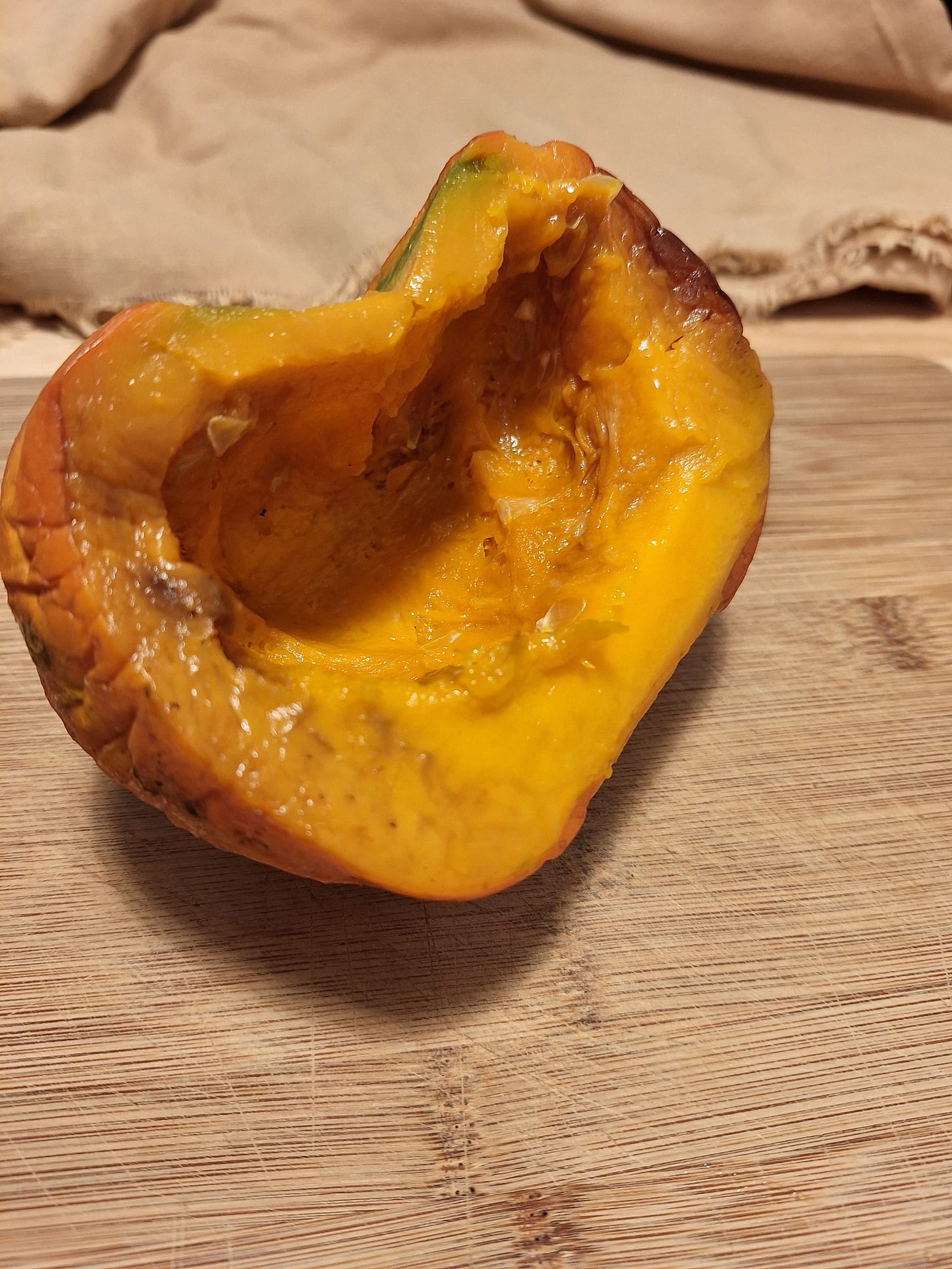 half of a cooked red kabucha squash