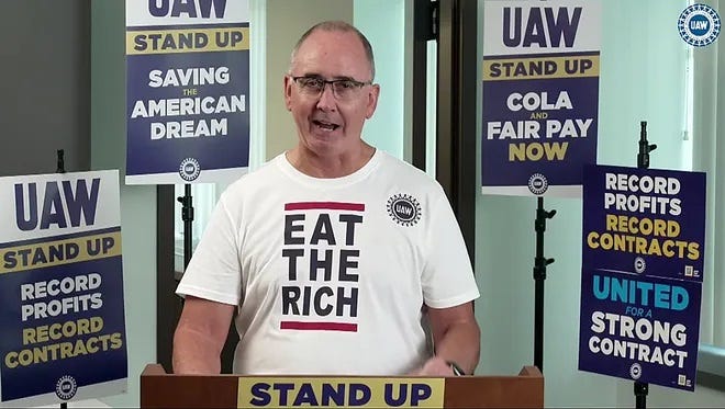 UAW President Shawn Fain, wearing a T-shirt reading "Eat the Rich"