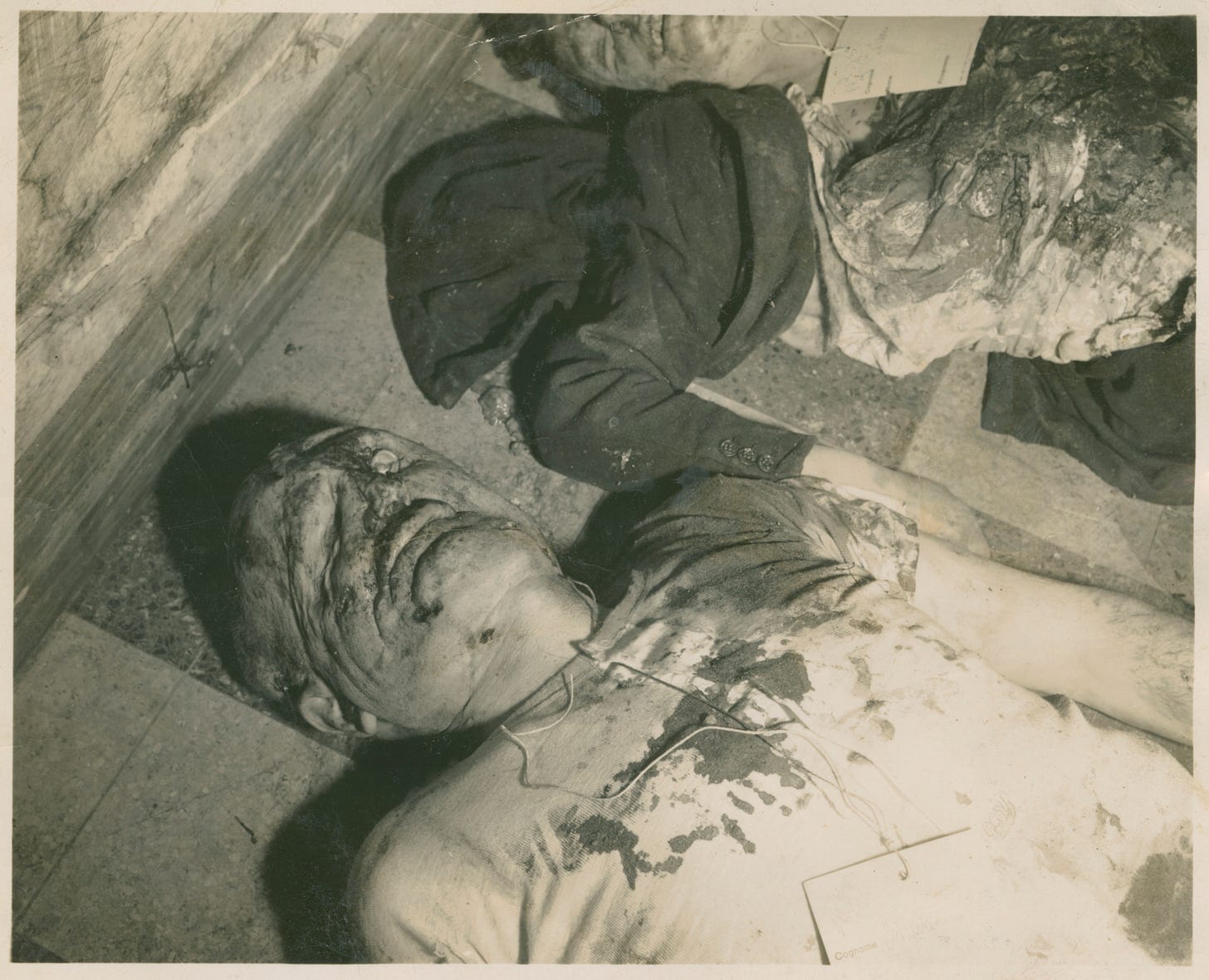 mangled bodies of Mussolini and his mistress, Claretta Petacci, lie on a  public square, in Milan on 28 Apr 1945. | The Digital Collections of the  National WWII Museum : Oral Histories