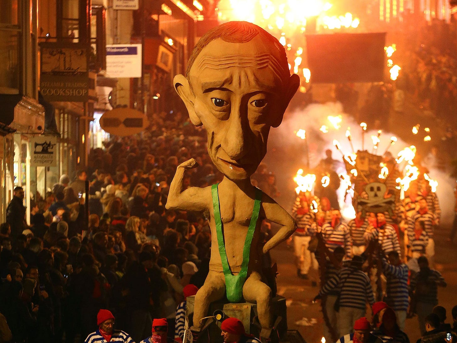 An effigy of Russian President Vladimir Putin is paraded through the town of Lewes in East Sussex where an annual bonfire night procession is held by the Lewes Bonfire Societies