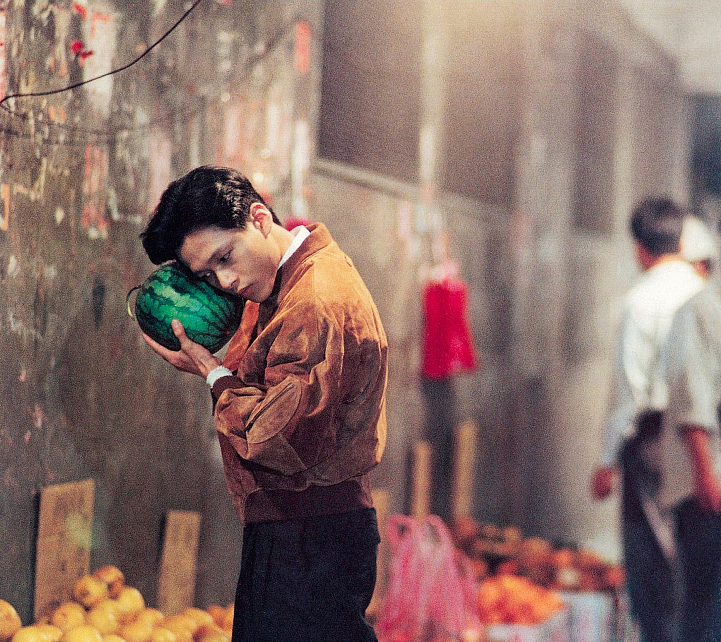 Lee Kang-sheng holds a melon in Tsai Ming-liang’s “Vive L'Amour” (1994)