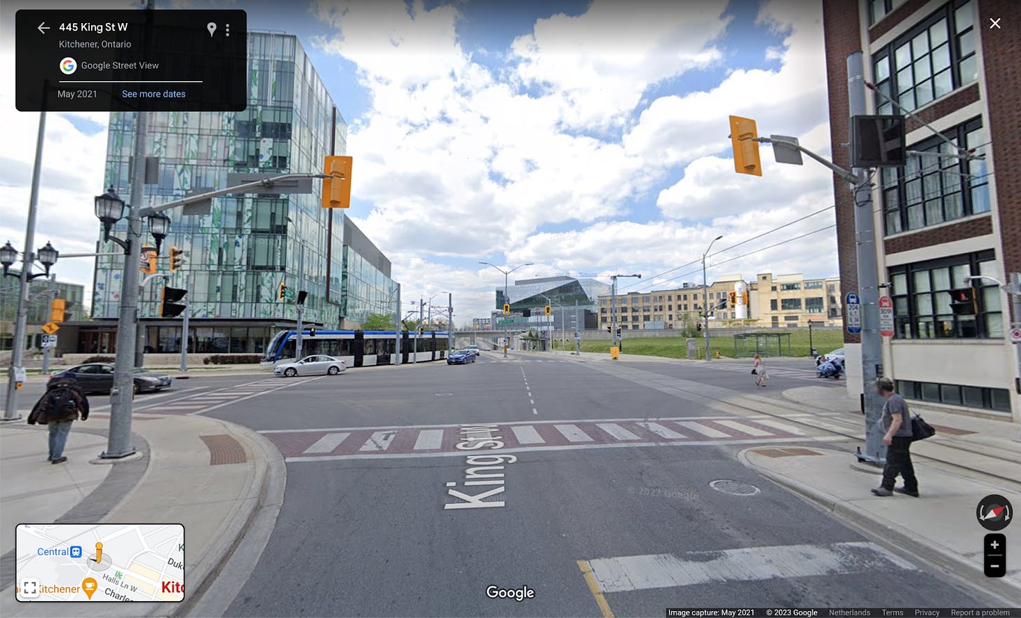 A streetview image of an intersection in Canada, the perspective is in an approach lane about 20 meters back from the stopping line looking towards the intersection.