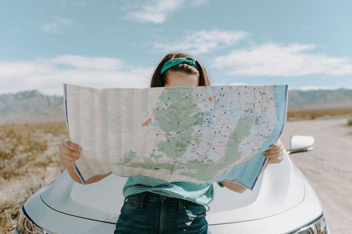 Free Woman Looking At The Map Stock Photo