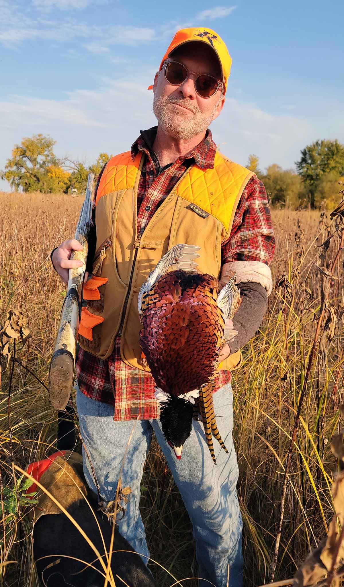 Hank Shaw holding a pheasant. 