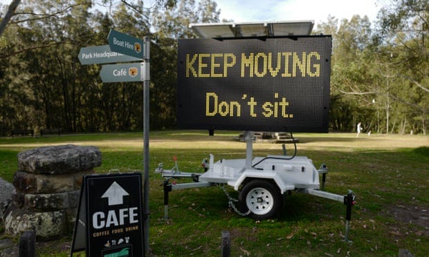 sign in park during sydney lockdown telling parkgoers not to sit