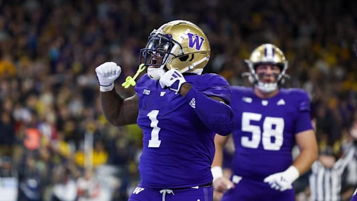 Oct 5, 2024; Seattle, Washington, USA; Washington Huskies running back Jonah Coleman (1) celebrates after rushing for a touchdown against the Michigan Wolverines during the fourth quarter at Alaska Airlines Field at Husky Stadium. Mandatory Credit: Joe Nicholson-Imagn Images