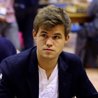 DUBAI, UNITED ARAB EMIRATES - JUNE 19: Magnus Carlsen of Norway looks on prior to the start of round three  during the FIDE World Rapid & Blitz Chess Championships 2014 at  Dubai Chess and Culture Club on June 19, 2014 in Dubai, United Arab Emirates.  (Photo by Francois Nel/Getty Images)