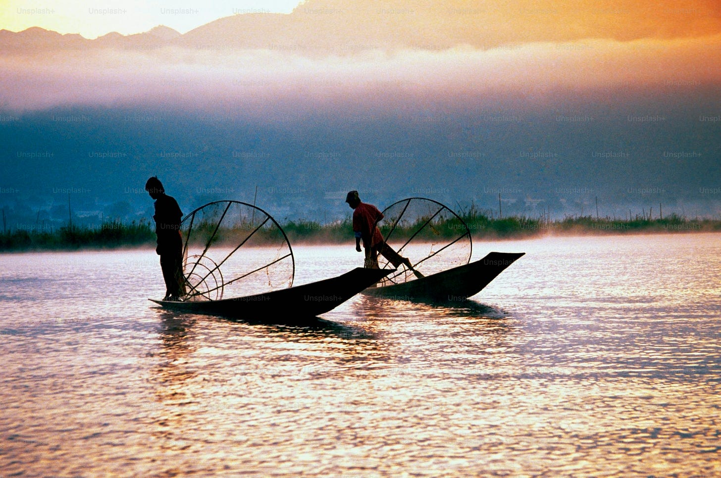 a couple of people on a boat in the water