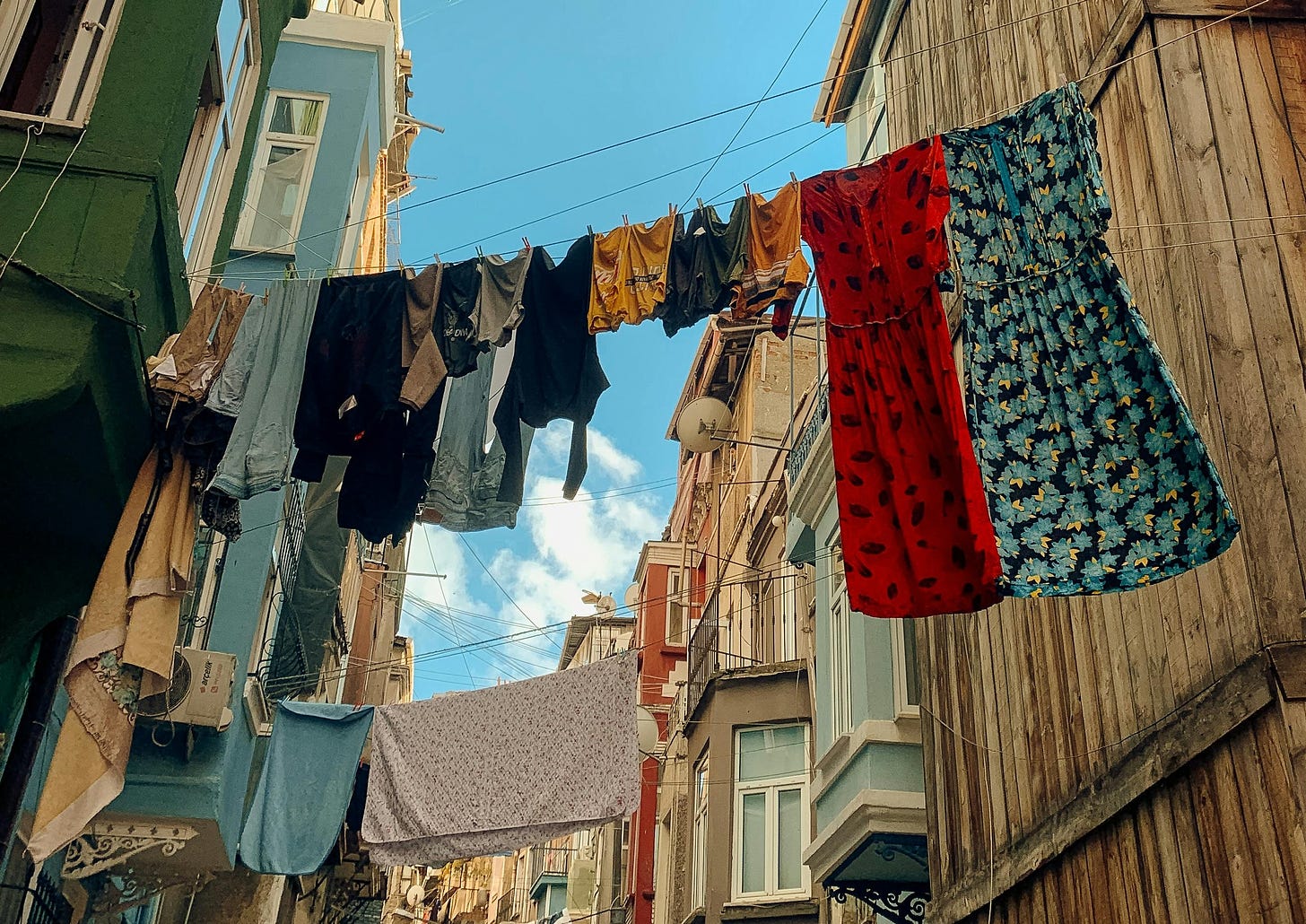 Clothes hanging lines between buildings on a narrow street
