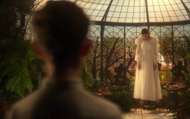 This still photo from Star Trek: Picard Season 2's ninth episode ("Hide and Seek") shows Young Jean-Luc Picard (played by Dylan Von Halle) seeing his mother, Yvette (played by Madeline Wise), hanging dead in Château Picard's cupola. Young Picard's back fills the image's left side, while Yvette, wearing a white dress, has her neck in a noose hung from the cupola's rafters. This still photo from Star Trek: Picard Season 2's ninth episode ("Hide and Seek") shows Young Jean-Luc Picard (played by Dylan Von Halle) seeing his mother, Yvette (played by Madeline Wise), hanging dead in Château Picard's cupola. Young Picard's back fills the image's left side, while Yvette, wearing a white dress, has her neck in a noose hung from the cupola's rafters.