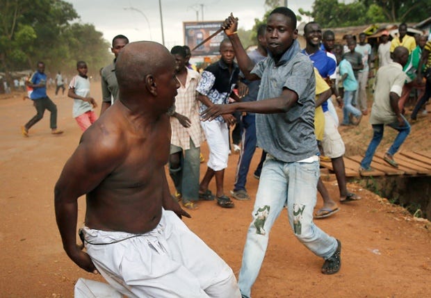 9 Dec: A Christian man with a knife chases a suspected Seleka officer in civilian clothes near the airport in Bangui. 9 Dec: A Christian man with a knife chases a suspected Seleka officer in civilian clothes near the airport in Bangui.