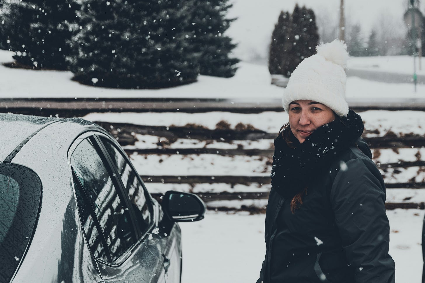 woman near car in snow woman near car in snow