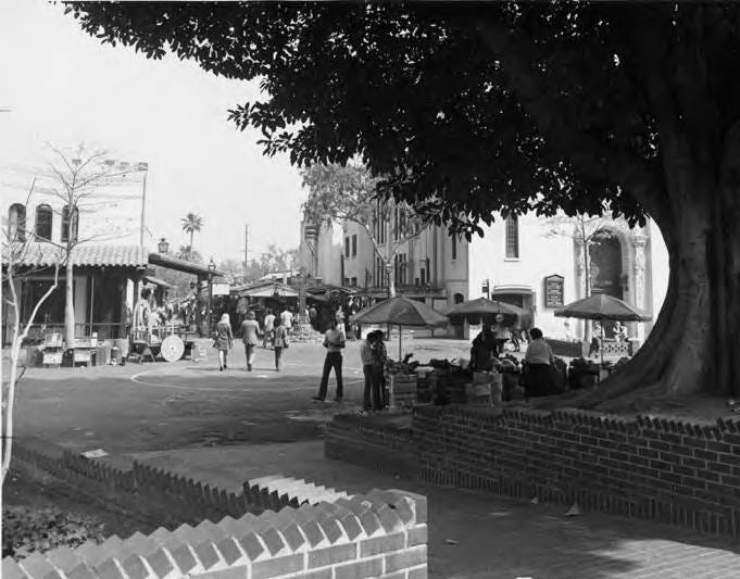 Photograph of Olvera Street in front of the Olvera Street cross Photograph of Olvera Street in front of the Olvera Street cross