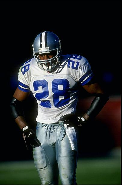 Short safety Darren Woodson of the Dallas Cowboys looks on during a game against the Arizona Cardinals at the Sun Devil Stadium in Tempe, Arizona....