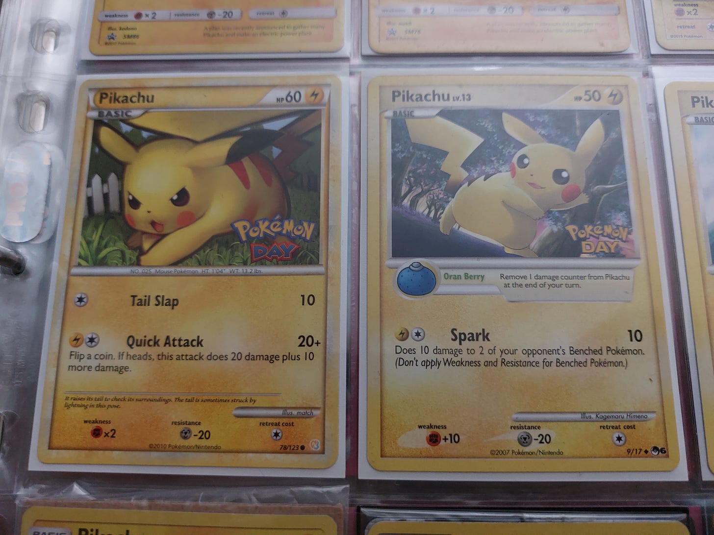 Pikachu promo cards from the 2008 and 2010 Pokémon Day events that Kimberley attended