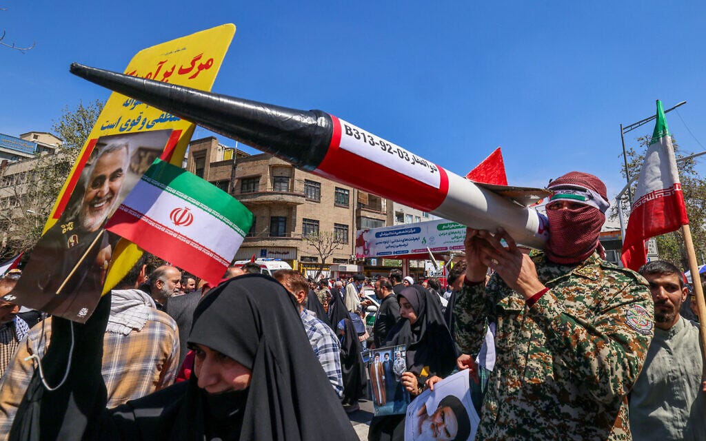Iranians attend the funeral procession for seven Islamic Revolutionary Guard Corps members killed in a strike in Syria, which Iran blamed on Israel, in Tehran on April 5, 2024. (Atta Kenare/AFP)