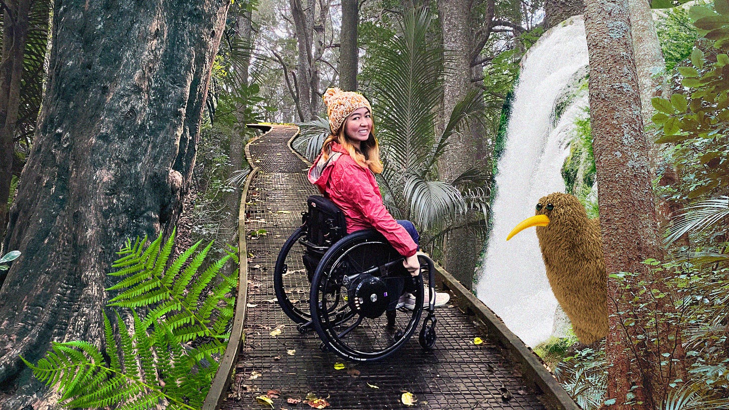Olivia is a wheelchair-user and wears a red raincoat. She is wheeling along wooden boardwalk in a forest with a waterfall and cartoon kiwi bird nearby.