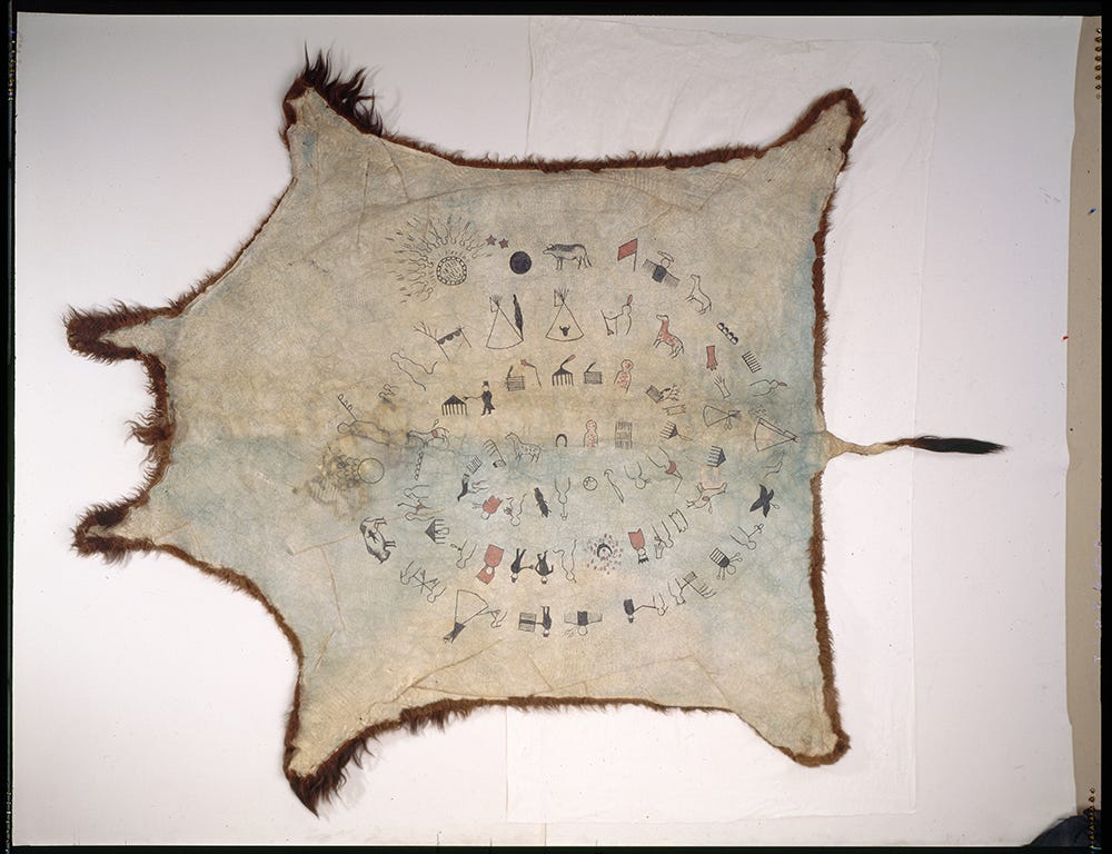 A buffalo hide with a spiral of drawings on it. https://d43fweuh3sg51.cloudfront.net/media/media_files/12b646d3-9757-48fc-8d7d-ac99178afdf9/34040fd0-6f30-430d-b13d-1aee1ec72266.png