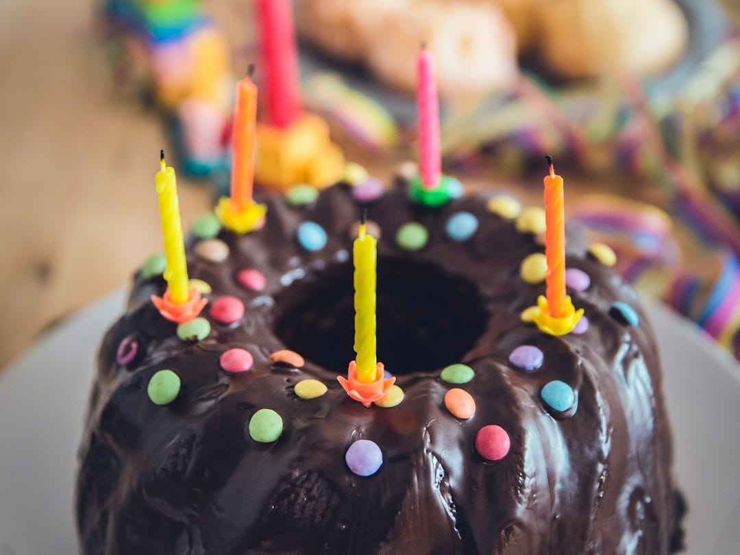 black cake with candles