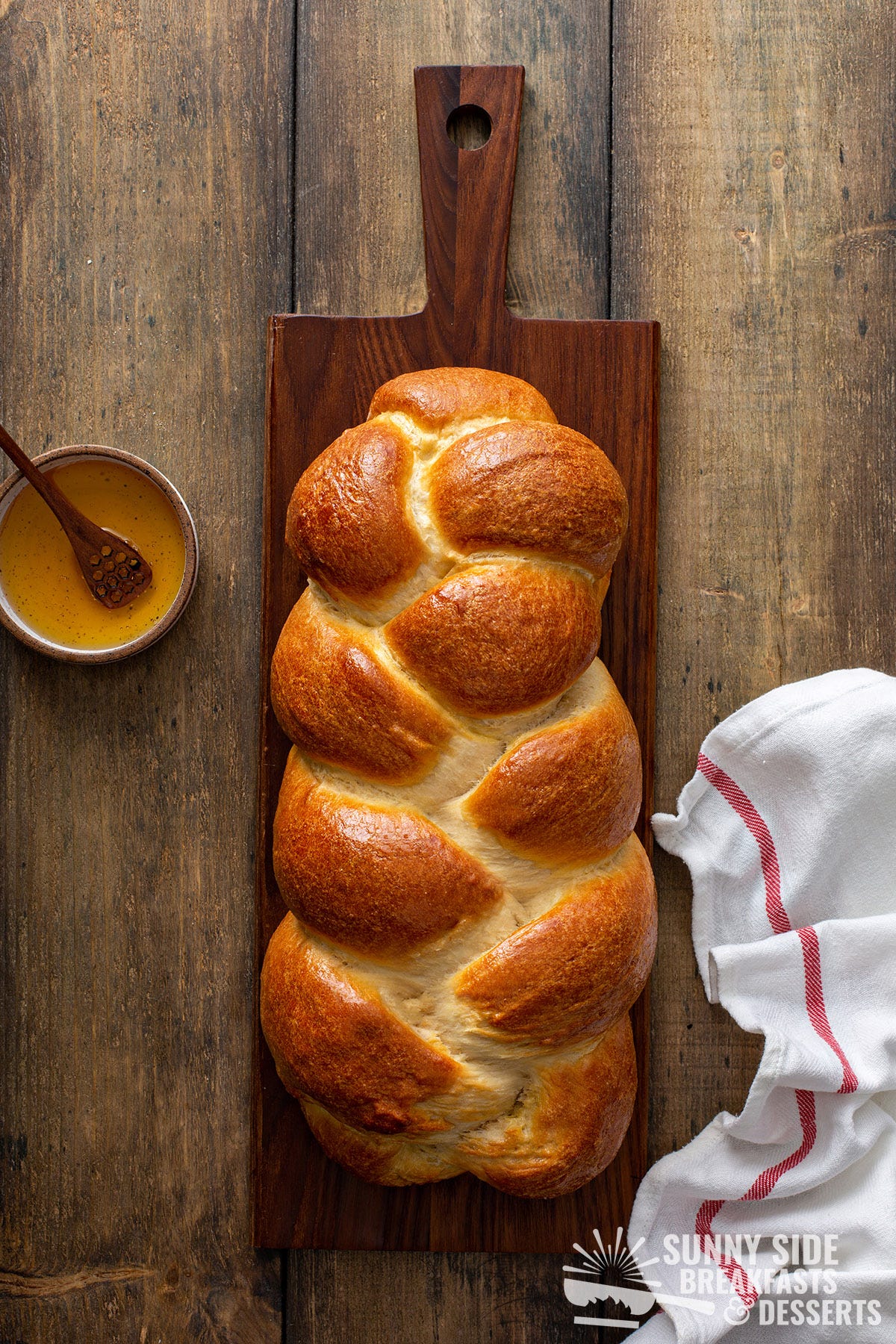 A golden loaf of braided challah.