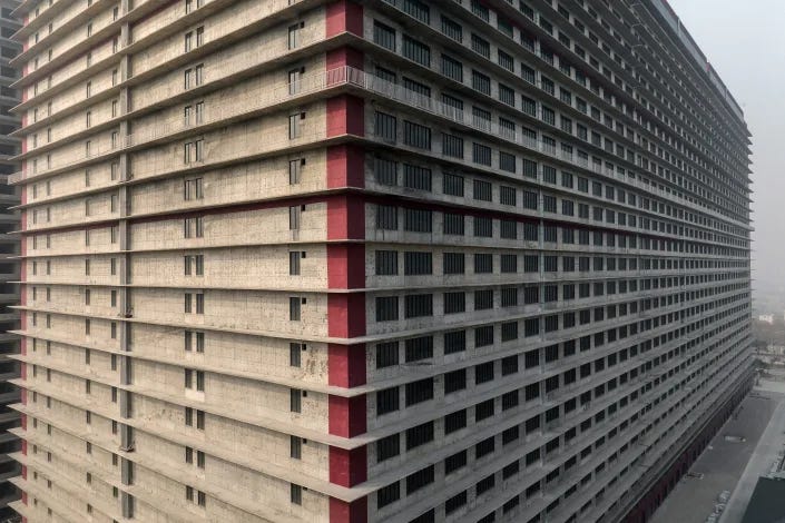 A 26-story building housing an uban pig farm on the outskirts of Ezhou, China, on Jan. 10, 2023. (Gilles Sabrie/The New York Times)
