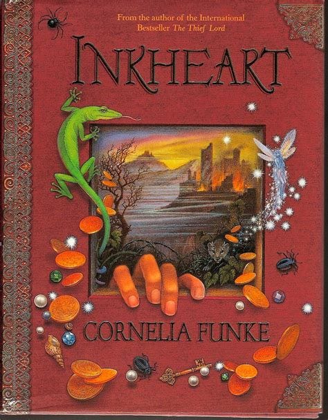 the cover of Inkheart by Cornelia funk. A lizard crawls over the top left corner of a window, which opens to a mystical world. There’s a hand at the bottom of the window, attempting to climb out of that world and into this one. Jewels, coins, beetles, shells, a key spill around. A fairy flits about. 