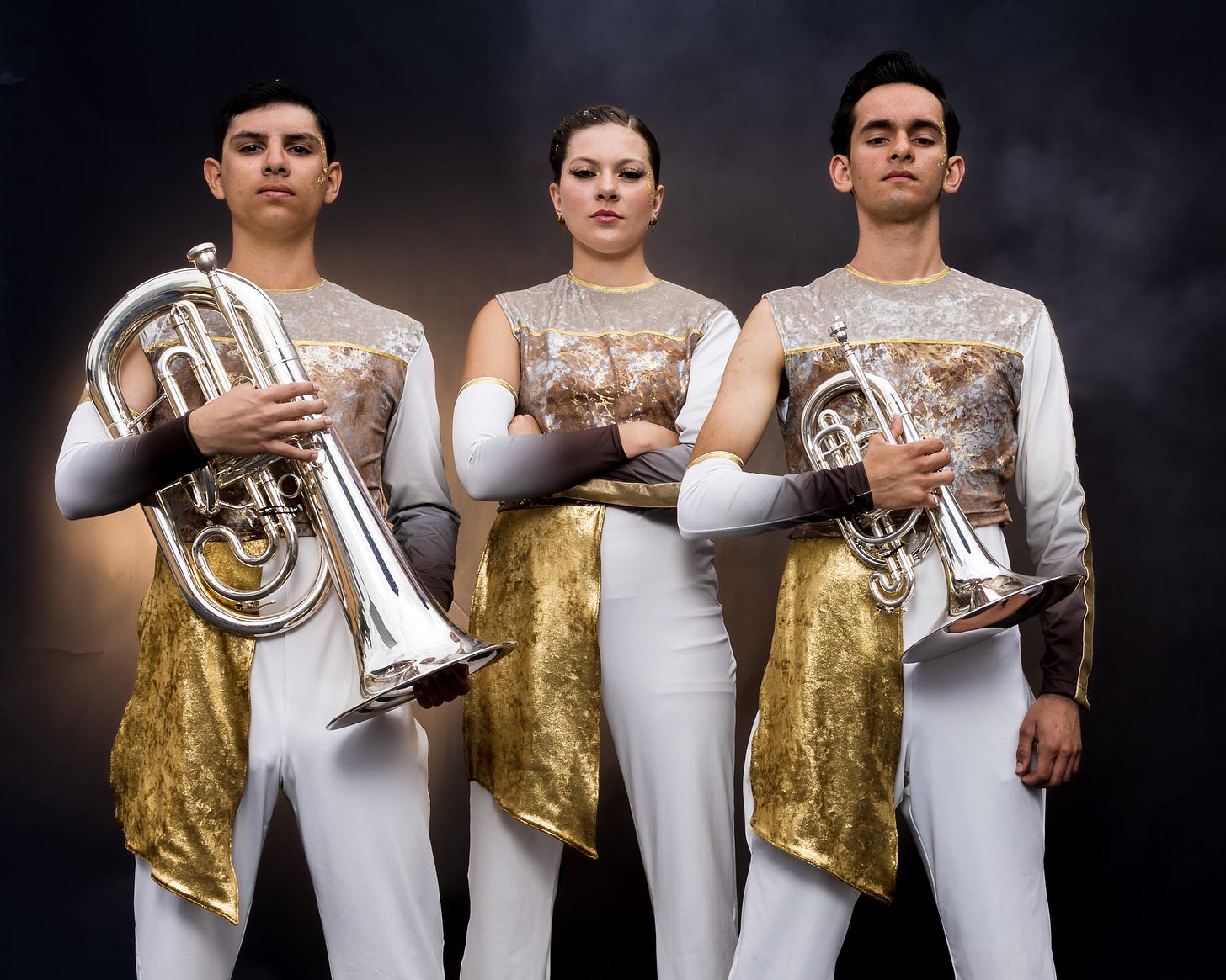 May be an image of 3 people, clarinet, saxophone, brass and trumpet