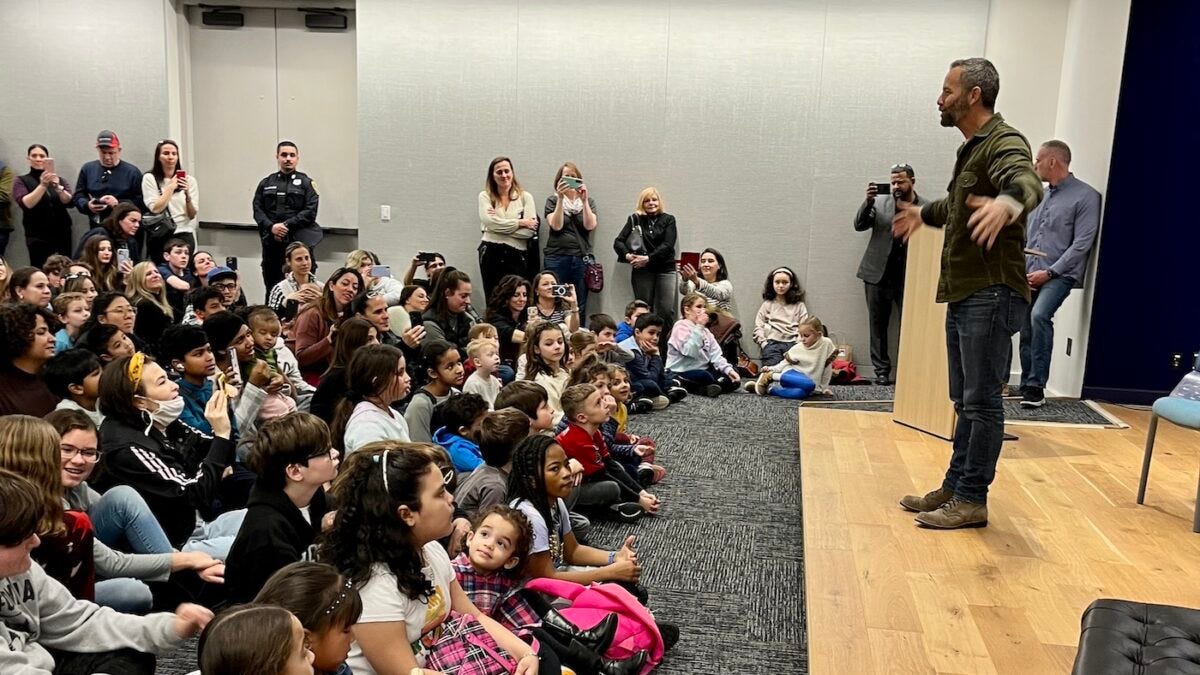 Kirk Cameron hosting a children's story hour in a library