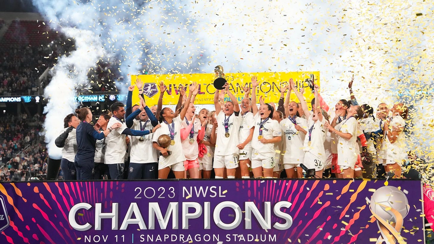 nwsl 2023 champions photo holding up trophy