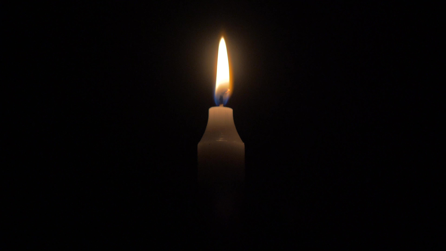 4K Candle Burning Against Black Background 1784594 Stock Video at Vecteezy